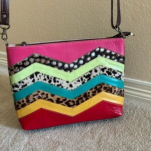 Never used cute fun multi-pattered crossbody bag. Upcycled leather